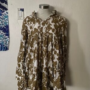 White dress with green plant designs